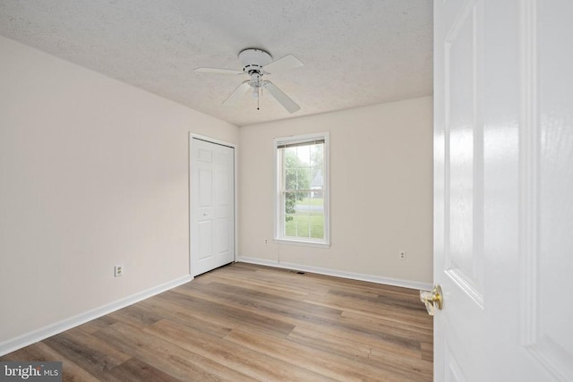 11810 Falcon Ridge Dr, Fredericksburg, VA 22407 - unfurnished room with baseboards, wood finished floors, a textured ceiling, and ceiling fan