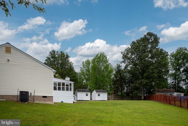 11810 Falcon Ridge Dr, Fredericksburg, VA 22407 - view of yard featuring central AC unit and a sunroom