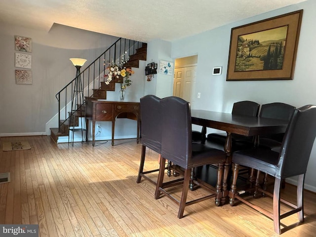 11223 Beales Branch Ln, Remington, VA 22734 - dining area featuring stairway, wood-type flooring, and visible vents