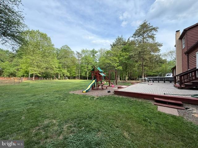 11223 Beales Branch Ln, Remington, VA 22734 - view of jungle gym featuring a lawn and a wooden deck