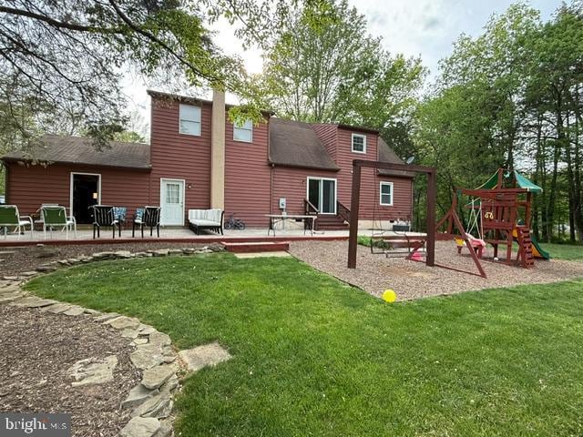 11223 Beales Branch Ln, Remington, VA 22734 - back of property with a playground, a yard, a chimney, and a patio area