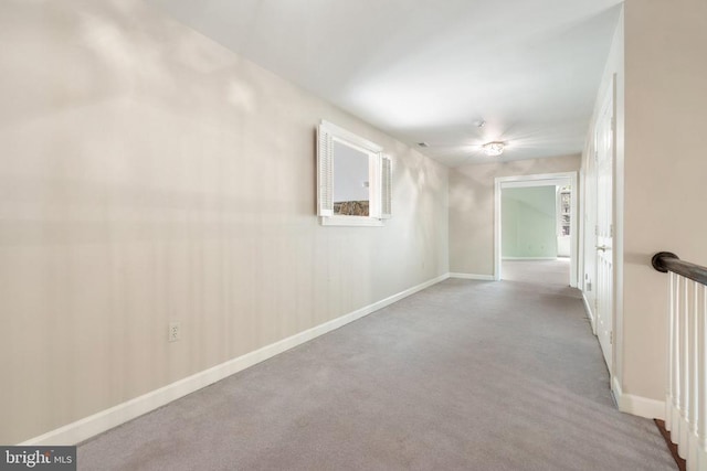  - interior space featuring carpet flooring and baseboards