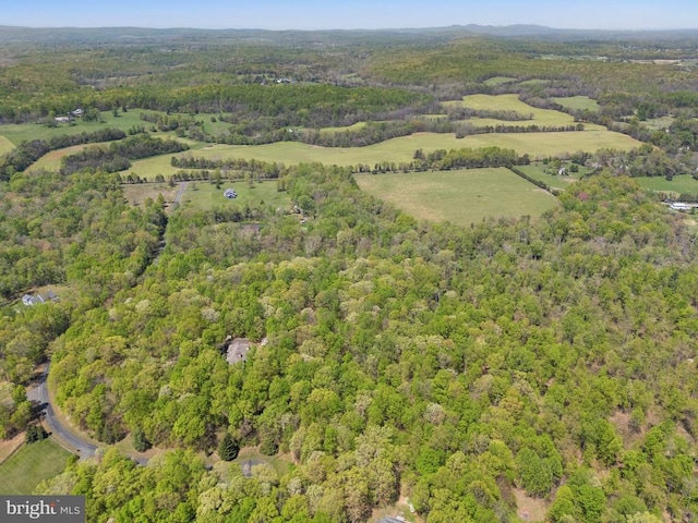  - birds eye view of property with a forest view