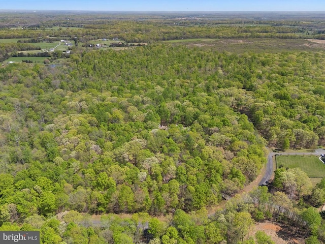  - drone / aerial view with a view of trees