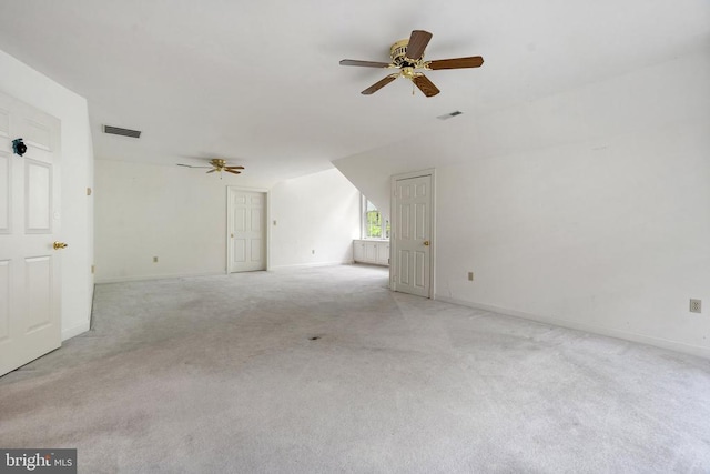  - interior space with light colored carpet, visible vents, baseboards, and ceiling fan