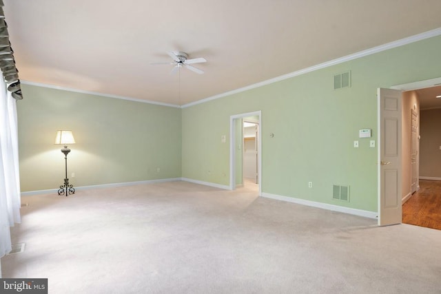  - unfurnished room with crown molding, visible vents, and a ceiling fan