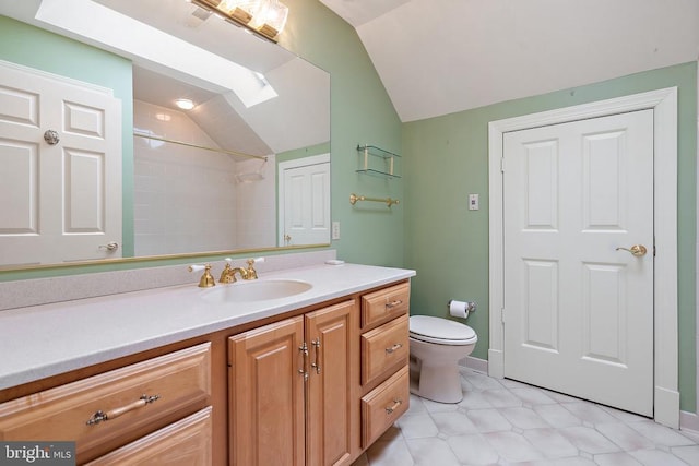  - full bathroom featuring toilet, a tile shower, baseboards, vaulted ceiling, and vanity