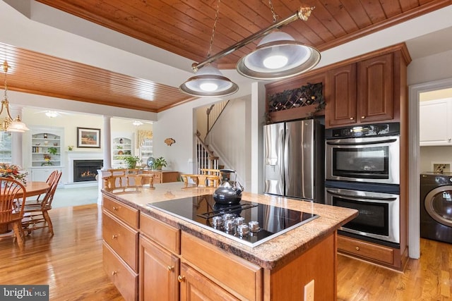 11918 Boulder Ct, Spotsylvania, VA 22553 - kitchen featuring washer / clothes dryer, wooden ceiling, appliances with stainless steel finishes, crown molding, and a kitchen island