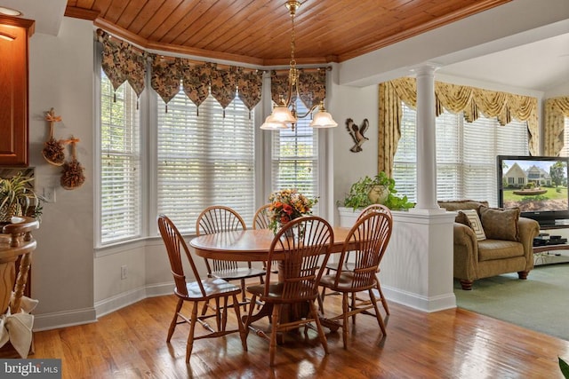 11918 Boulder Ct, Spotsylvania, VA 22553 - dining area featuring crown molding, decorative columns, wood ceiling, and light wood finished floors