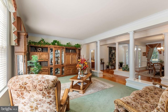 11918 Boulder Ct, Spotsylvania, VA 22553 - living area featuring decorative columns, crown molding, a chandelier, and wood finished floors