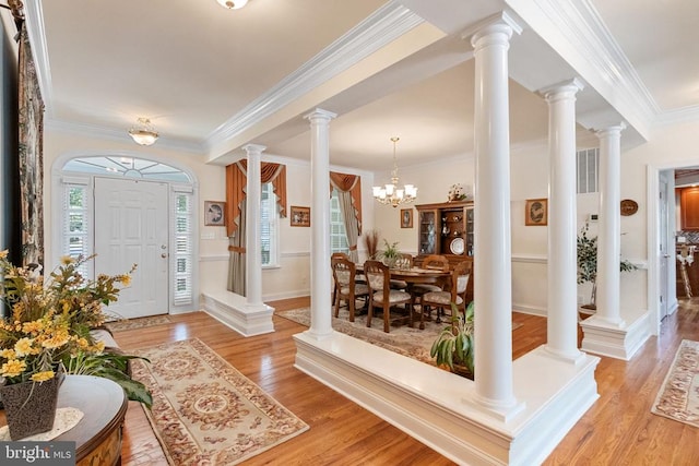 11918 Boulder Ct, Spotsylvania, VA 22553 - entrance foyer featuring light wood-style floors, ornamental molding, and a chandelier