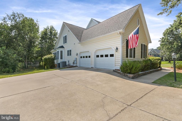 11918 Boulder Ct, Spotsylvania, VA 22553 - view of property exterior featuring concrete driveway, a shingled roof, and a garage