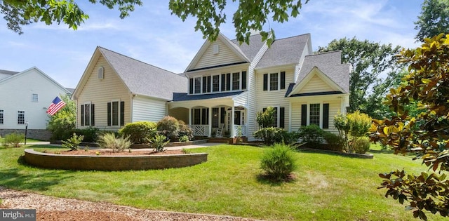 11918 Boulder Ct, Spotsylvania, VA 22553 - view of front of house featuring a front yard, a porch, and roof with shingles