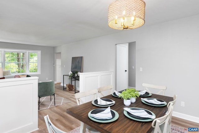 1601 Antoinette Ave, Charlottesville, VA 22903 - dining space with light wood-style floors and a chandelier