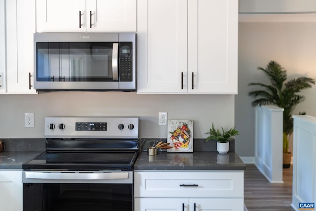 1601 Antoinette Ave, Charlottesville, VA 22903 - kitchen featuring stainless steel appliances, white cabinetry, and wood finished floors