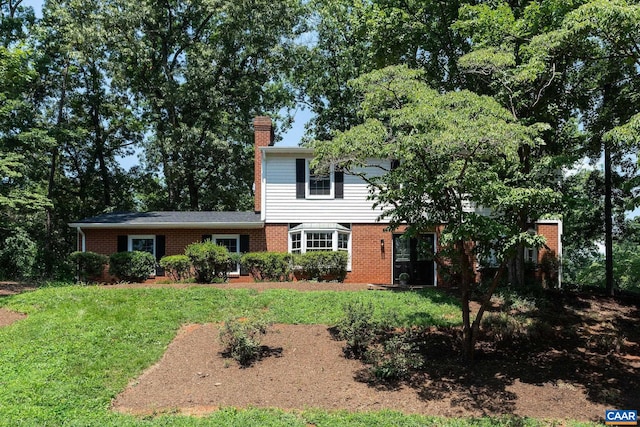 1601 Antoinette Ave, Charlottesville, VA 22903 - view of front of property featuring a chimney, a front yard, and brick siding