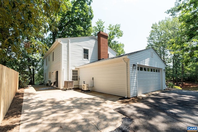 1601 Antoinette Ave, Charlottesville, VA 22903 - view of property exterior featuring a detached garage and a chimney