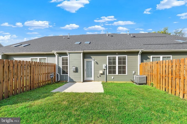 5711 Finley Rose Ct, Fredericksburg, VA 22407 - rear view of house featuring a fenced backyard, a patio, and roof with shingles