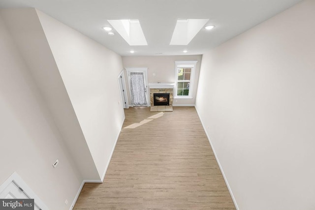 5711 Finley Rose Ct, Fredericksburg, VA 22407 - corridor featuring a skylight, light wood-style flooring, and recessed lighting