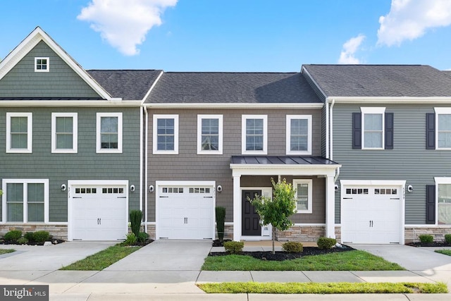 5711 Finley Rose Ct, Fredericksburg, VA 22407 - multi unit property with stone siding, a standing seam roof, a garage, and roof with shingles