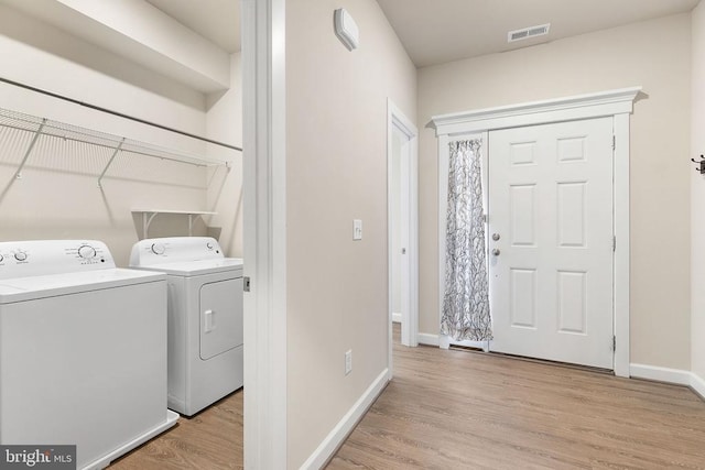5711 Finley Rose Ct, Fredericksburg, VA 22407 - washroom with washing machine and clothes dryer and light wood finished floors