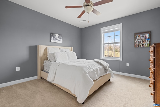 bedroom featuring light carpet, baseboards, and visible vents