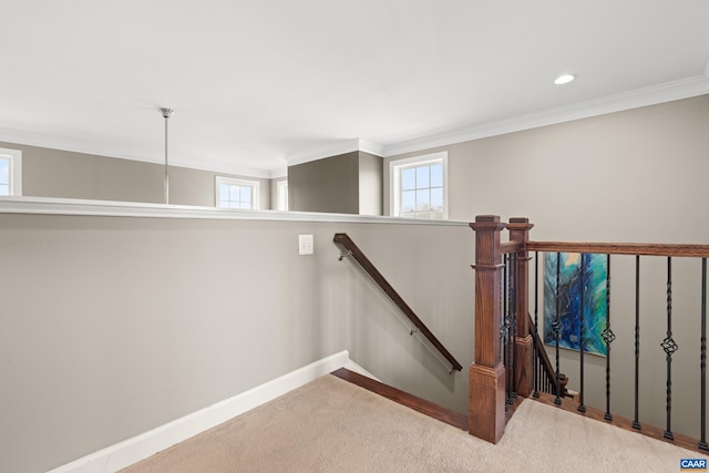 stairway featuring carpet flooring, crown molding, baseboards, and recessed lighting