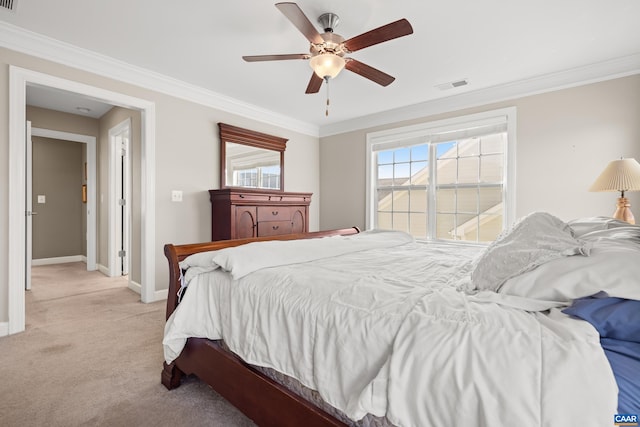 bedroom featuring visible vents, baseboards, ornamental molding, and light carpet