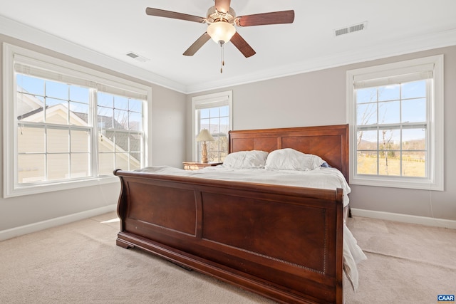 bedroom with baseboards, visible vents, and light colored carpet