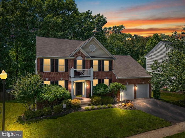 249 Whitworth Dr, Culpeper, VA 22701 - colonial inspired home with driveway, a balcony, a garage, brick siding, and a lawn