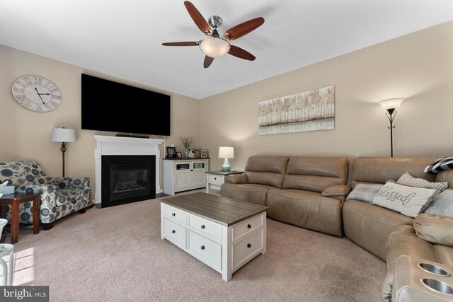 249 Whitworth Dr, Culpeper, VA 22701 - living room featuring a ceiling fan, light colored carpet, and a fireplace with flush hearth