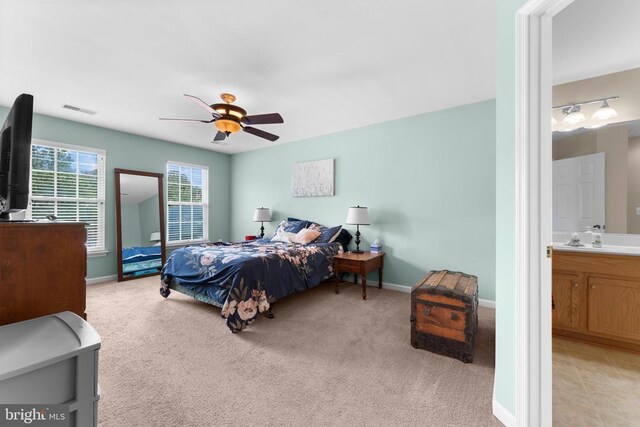 249 Whitworth Dr, Culpeper, VA 22701 - bedroom with light carpet, ceiling fan, and connected bathroom