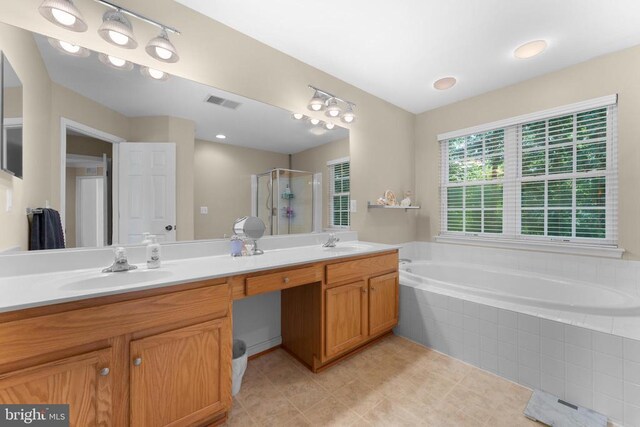 249 Whitworth Dr, Culpeper, VA 22701 - bathroom featuring a shower stall, double vanity, a bath, and tile patterned flooring