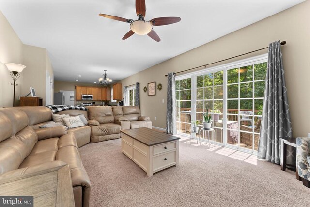 249 Whitworth Dr, Culpeper, VA 22701 - living area with light carpet, ceiling fan, and a chandelier