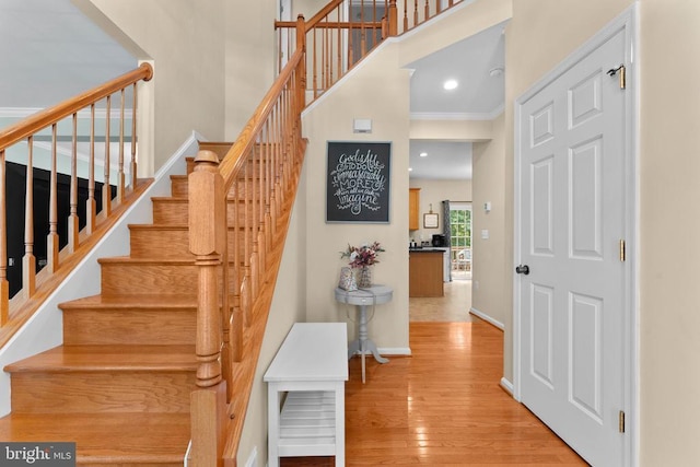249 Whitworth Dr, Culpeper, VA 22701 - stairs featuring a high ceiling, wood finished floors, ornamental molding, and recessed lighting