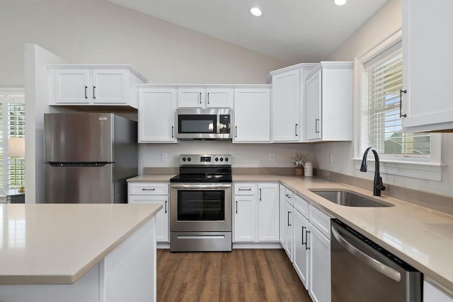 170 Lindburgh Dr, Waynesboro, VA 22980 - kitchen featuring appliances with stainless steel finishes, vaulted ceiling, white cabinets, plenty of natural light, and light countertops