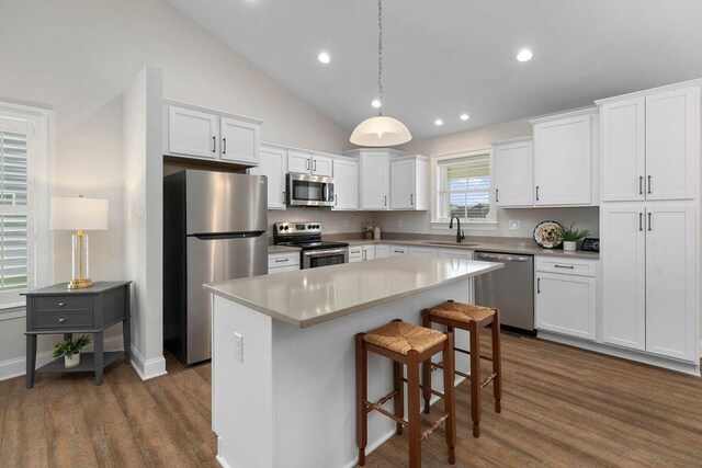 170 Lindburgh Dr, Waynesboro, VA 22980 - kitchen featuring stainless steel appliances, a center island, dark wood-type flooring, white cabinetry, and a kitchen breakfast bar