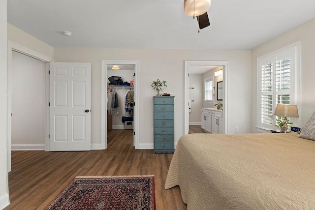 170 Lindburgh Dr, Waynesboro, VA 22980 - bedroom with wood finished floors, a walk in closet, a closet, connected bathroom, and a ceiling fan