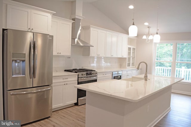5208 Wyndemere Cir, Mineral, VA 23117 - kitchen featuring appliances with stainless steel finishes, a sink, light wood-style floors, decorative backsplash, and white cabinetry