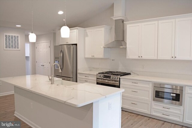 5208 Wyndemere Cir, Mineral, VA 23117 - kitchen featuring stainless steel appliances, white cabinetry, recessed lighting, wall chimney range hood, and an island with sink