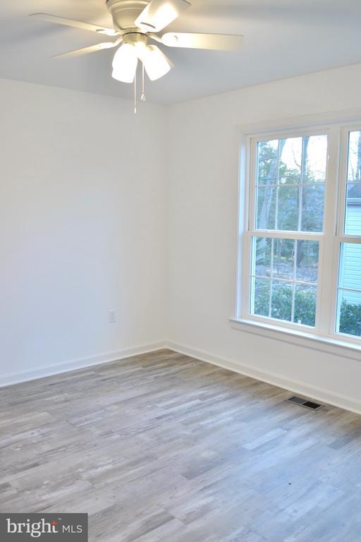 5208 Wyndemere Cir, Mineral, VA 23117 - spare room featuring plenty of natural light and wood finished floors