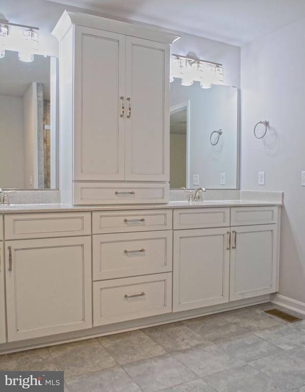 5208 Wyndemere Cir, Mineral, VA 23117 - full bathroom featuring double vanity and baseboards