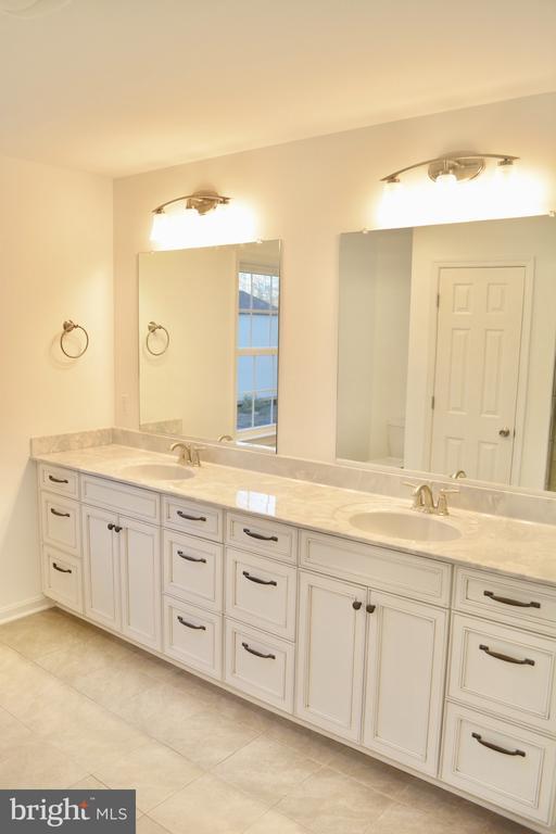 5208 Wyndemere Cir, Mineral, VA 23117 - full bath featuring double vanity and tile patterned flooring