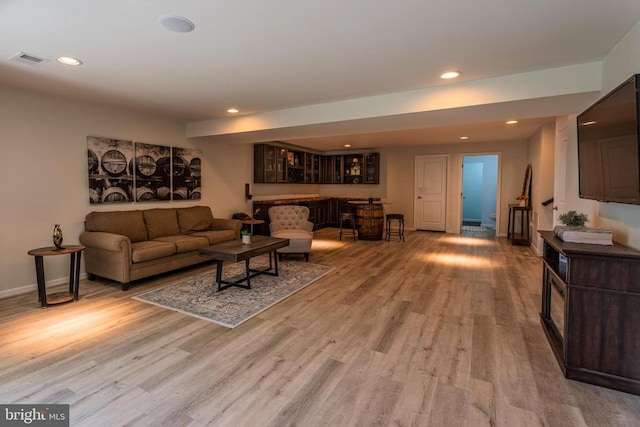 2045 Magnolia Cir, Culpeper, VA 22701 - living room featuring light wood-type flooring, recessed lighting, baseboards, and bar