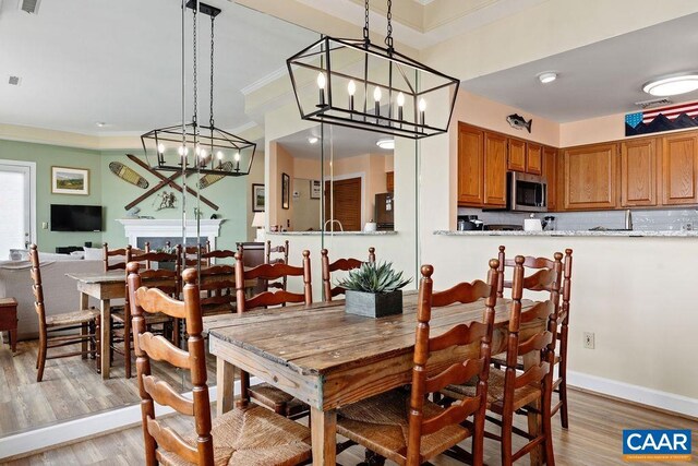 1808 High Ridge Ct, Condos, Wintergreen Resort, VA 22967 - dining room with light wood-style floors, ornamental molding, a chandelier, and baseboards