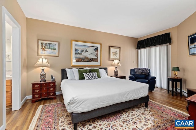 1808 High Ridge Ct, Condos, Wintergreen Resort, VA 22967 - bedroom with wood finished floors, baseboards, and a baseboard heating unit