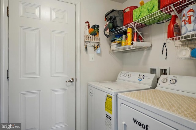 laundry area with washing machine and clothes dryer