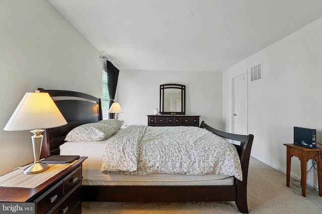 carpeted bedroom featuring baseboards