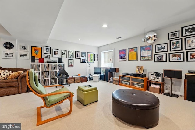 living area featuring recessed lighting and carpet flooring