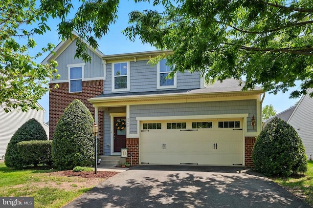 traditional-style home featuring brick siding, driveway, a garage, and board and batten siding